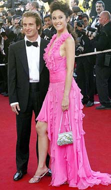 Italian Formula One driver Jarno Trulli arrives with an unidentified woman for the screening of the film "The Ladykillers" shown in competition at the 57th International Film Festival in Cannes, southern France, on Tuesday.