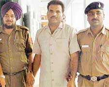 Uttar Pradesh�s most- wanted criminal Ran Pal Singh Gujjar in police custody in Chandigarh on Thursday. 