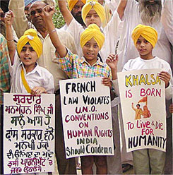 A group of Sikh children appeal to Prime Minister designate Dr Manmohan Singh to look after the controversial French law on turbans