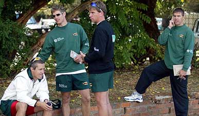 Rebel Zimbabwe cricketers Stuart Carlisle, Andy Blignaut, Ray Price and former captain Heath Streak wait outside the office of the Zimbabwe Cricket Union 
