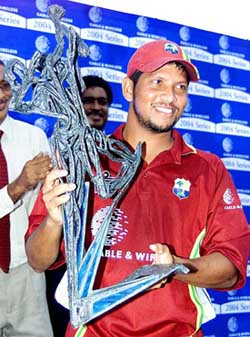 West Indies skipper Ramnaresh Sarwan poses with the ODI trophy after beating Bangladesh in the third and final ODI in St. George's