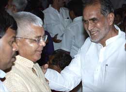 RJD supermo Laloo Prasad Yadav is greeted by former Prime Minister Chandra Shekhar after being sworn in as Cabinet Minister at Rashtrapati Bhavan in New Delhi on Saturday. 