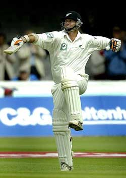 New Zealand's Mark Richardson celebrates after reaching his century 