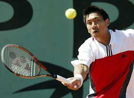 Paradon Srichaphan of Thailand eyes the ball during his match against Tomas Berdych of the Czech Republic in the first round of the French Open