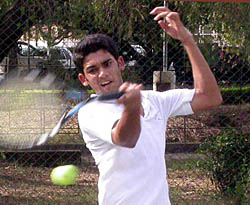 Navinder Singh in action during the AITA Talent Series Tennis Tournament being played at the CLTA, Chandigarh, on Tuesday.