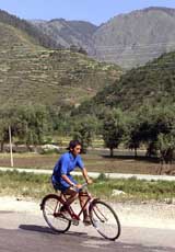 A schoolboy cycles during a "Race for Peace"