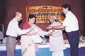 Sanskrit scholar Dr Sarita Vashisth of Kurukshetra University being honoured for her translation work by the Akhil Bharatiya Sahitya Parishad