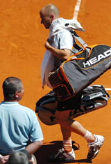 Andre Agassi leaves the court after his first-round match of the French Open tennis tournament against France�s Jerome Haehnel at the Roland Garros stadium in Paris