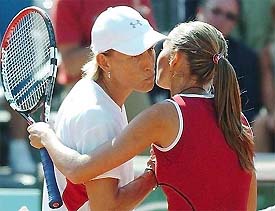 Argentina's Gisela Dulko kisses USA's Martina Navratilova after their first round match at the French Open