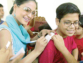 Pakistani actress Veena Malik signs autographs for children attending a summer workshop at Punjab Kala Bhavan, Sector 16, Chandigarh, on Thursday.