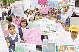 Holding placards, students of Government Model Senior Secondary School, Sector 46, take part in an environment rally in Chandigarh on Thursday.