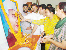 Congress workers offer floral tributes to a portrait of Pandit Jawaharlal Nehru at Rajiv Gandhi Bhavan in Sector 35, Chandigarh, on Thursday. 