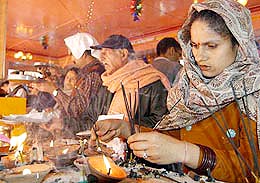 Devotees pray at Kheer Bhawani Temple, Tulmulla, outside Srinagar, on Thursday