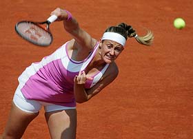 Mary Pierce of France serves to Gala Leon Garcia of Spain