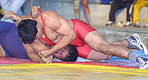 Wrestlers in action in the 25th All-India National Sub-Junior Wrestling Championship at Jalandhar on Thursday.