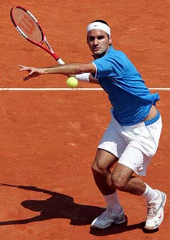 Roger Federer of Switzerland returns a forehand to Nicolas Kiefer of Germany