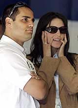 Columbian BMW Williams driver Juan Pablo Montoya and his wife Conny watch the practice session