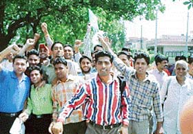 Candidates agitate outside the Phase 3B1 Government Senior Secondary School, Mohali, following the cancellation of a selection test