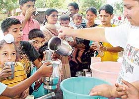 Sweetened milk being distributed at a "chhabil" on the occasion of Nirjala Akadishi in Sector 27, Chandigarh