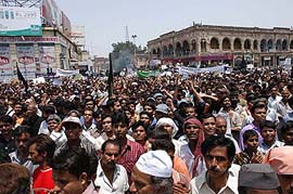 Muslims take out a large procession against alleged US atrocities and desecration of holy shrines