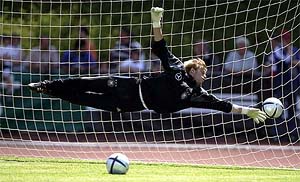 Timo Hildebrandt, goalkeeper of Germany' national football team, dives for the ball during a training session in Winden