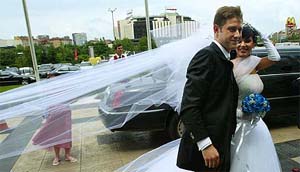 Bulgarian national football team and French club Lille striker Vladimir Manchev and his wife Eleonora pose for photographers before their wedding ceremony in Sofia