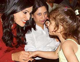 Femina Miss India World Sayali Bhagat charms a little fan with her smile during the convocation ceremony of the NIFD at Tagore Theatre in Chandigarh