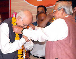 Former Deputy Prime Minister L. K. Advani is greeted by former Prime Minister Atal Bihari Vajpayee after he was elected Leader of the Opposition in the Lok Sabha at a BJP Parliamentary Party meeting in New Delhi on Tuesday. 