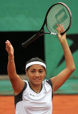 Paola Suarez of Argentina celebrates after defeating Maria Sharapova of Russia during their quarter-finals of the French Open