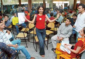 One of the participants at Zee TV’s audition rehearses in the waiting room of GGDSD College, Sector 32, while others look on