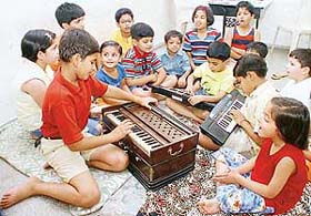 Tiny tots play on musical instruments at a 15-day workshop at Kiddies Playway School, Sector 38 (West), in Chandigarh