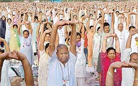People from the region participate in a week-long yoga camp conducted by Swami Ramdev in Panchkula