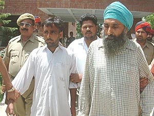 Manjit Singh Lati (right) and Manpreet Singh Kala, who have been arrested for killing an Amritsar goldsmith.