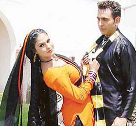 Pakistani actress Veena Malik and Punjabi actor Sarabjit Cheema shoot for the Indo-Pak film "Pind Di Kudi" at The Fort, Ramgarh