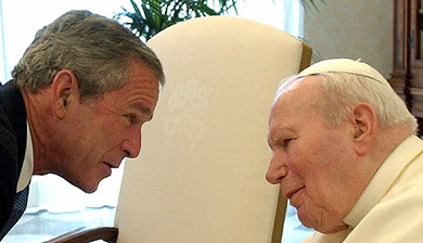 US President George W. Bush (left) greets Pope John Paul II during their meeting at the Vatican