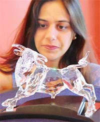 In charge of the Swarvoski Collectors Society in India Pooja Chaudhary with a product in Chandigarh