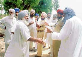 Members of rival groups have a heated exchange at Khaasi Kalan village