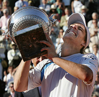 Gaston Gaudio of Argentina celebrates after the men�s final at the French Open tennis tournament against his compatiot Guillermo Coria at Roland Garros stadium 
