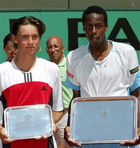 Gael Monfils of France and Alex Kuznetsov of the USA hold their trophies
