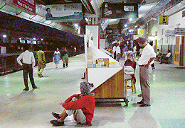 With all trains scheduled to arrive late, a porter relaxes at the railway station in Chandigarh on Monday night.