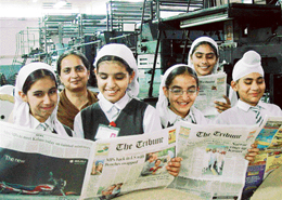 Students of Guru Gobind Singh Vidhya Mandir, Ratwara Sahib, Mullanpur, glance at the pages of The Tribune during their visit to The Tribune office on Monday.