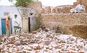 The collapsed wall under which five children were buried alive at Rai Majra village near Payal