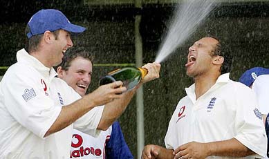 England captain Michael Vaughan sprays champagne at Mark Butcher after a series victory over New Zealand on the final day of the second Test