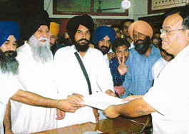 The SAD General Secretary, Capt Kanwaljit Singh, along with Mr Nirmail Singh who filed his nomination papers for the SGPC election in the office of Mr D.R. Garg, SDM, in Dera Bassi on Tuesday.