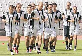 Members of the England squad warm up during a training session at the National Stadium in Lisbon