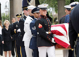 Former US First Lady Nancy Reagan looks on as a casket bearing the body of her husband, former US President Ronald Reagan, is carried to a hearse