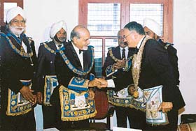 Yves-Max Viton (Grand Master of Grand Lodge of France) and Kapil Dev Joti (Grand Master of Grand Lodge of Upper India) greet each other after signing the Treaty