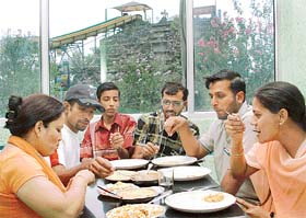 A group enjoys a meal at the Funcity amusement park