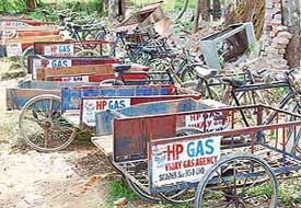 Empty handcarts of cooking gas distributors lie in Chandigarh