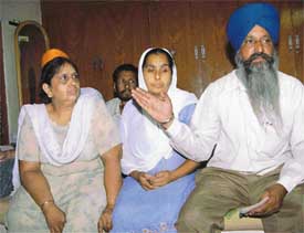 Roopinder Kaur�s father Kuldip Singh, mother Manjit Kaur and aunt at their house